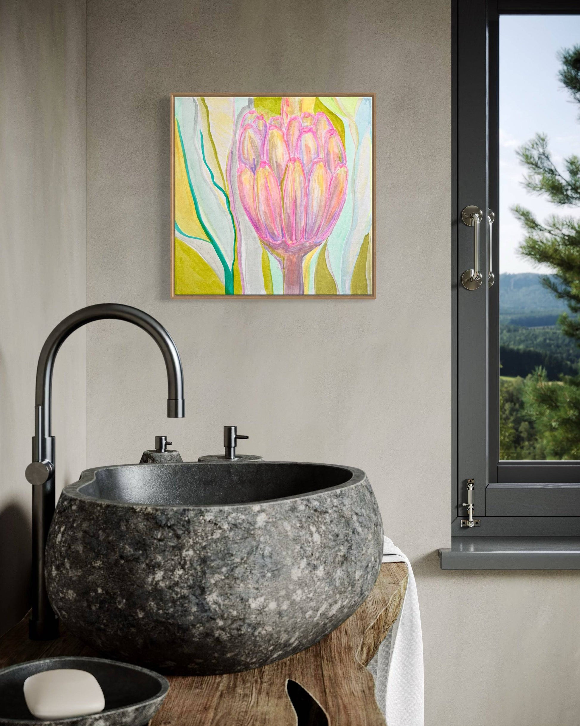 Modern bathroom with rustic stone sink, black faucet, and botanical abstract painting in pastel colors