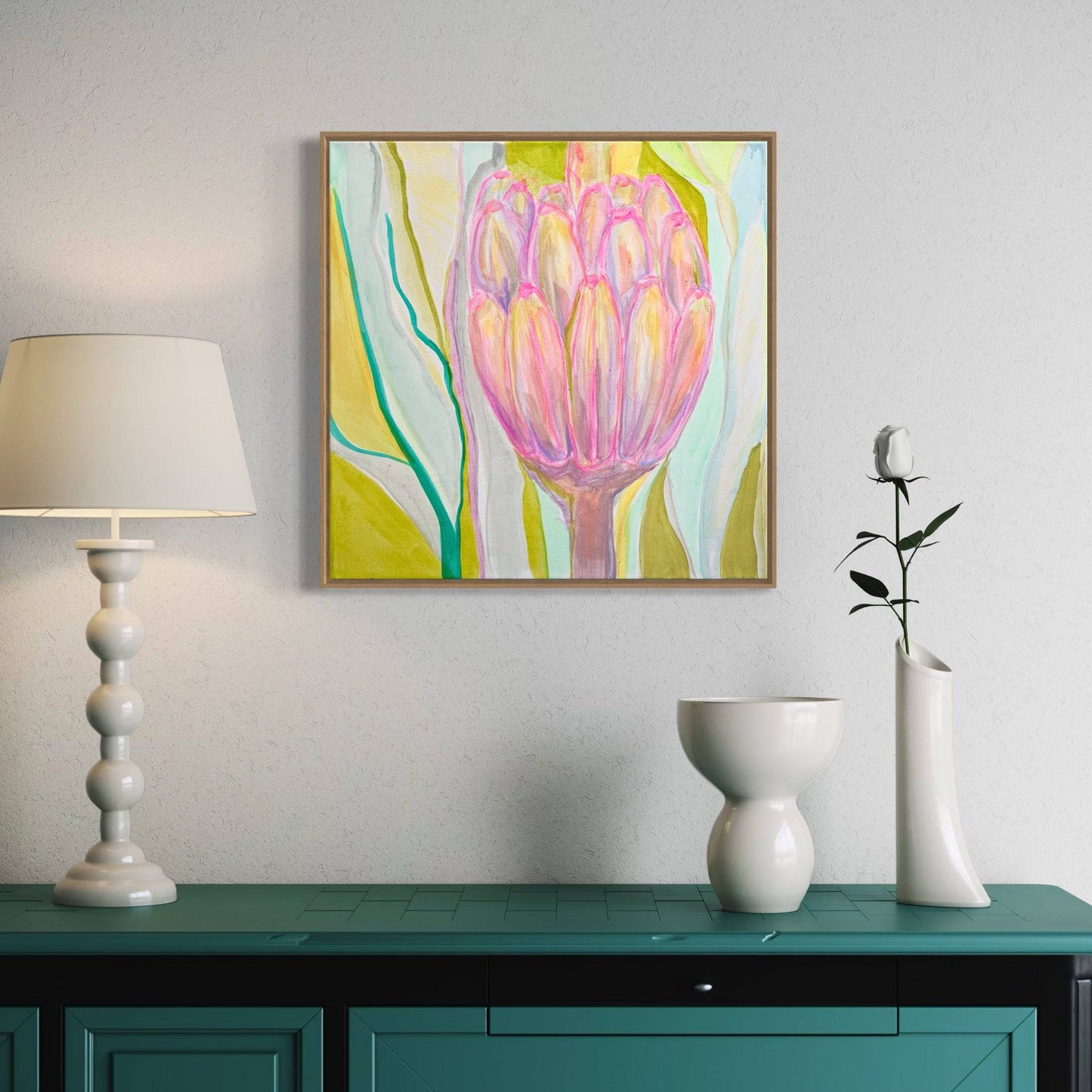 Kathryn Sillince botanical painting of a pink protea flower with green and blue abstract leaves in a modern interior