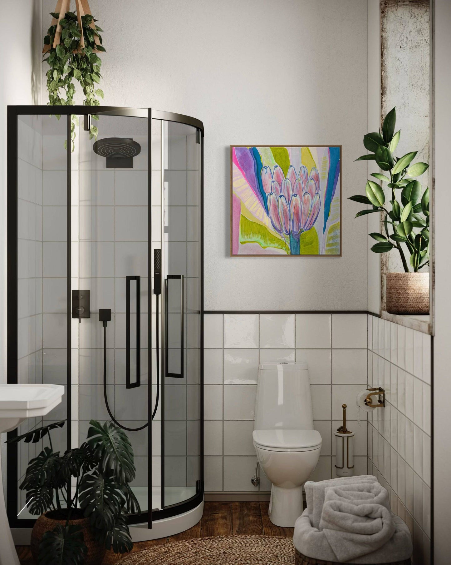 Modern bathroom with glass shower, white toilet, green plants, and colorful botanical painting by Kathryn Sillince