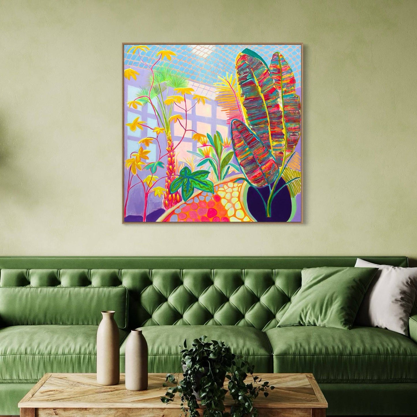 Colorful botanical abstract painting by Kathryn Sillince on green wall above green sofa with pillows