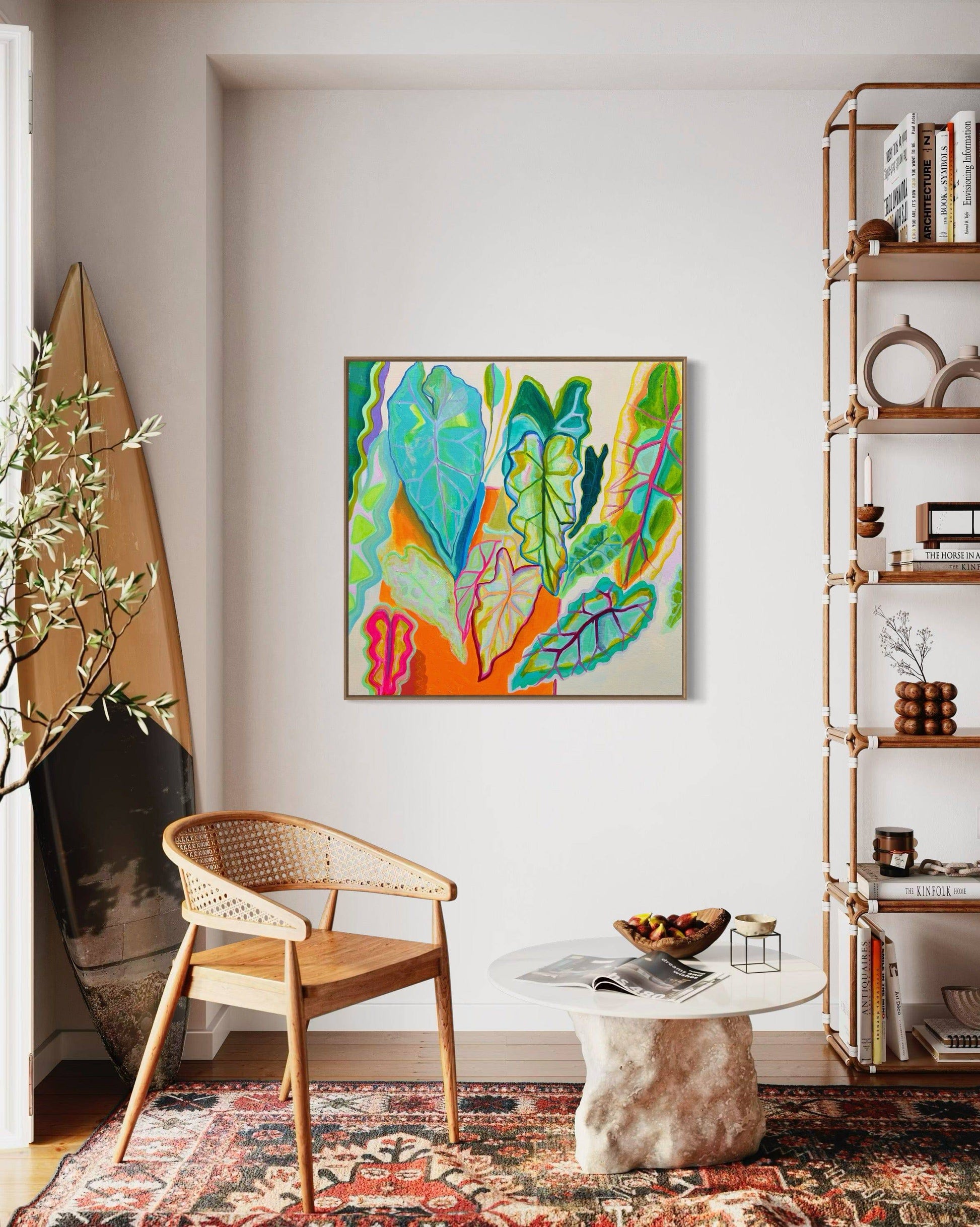 Bright botanical abstract painting by Kathryn Sillince in modern living room with wooden chair and sculptural coffee table
