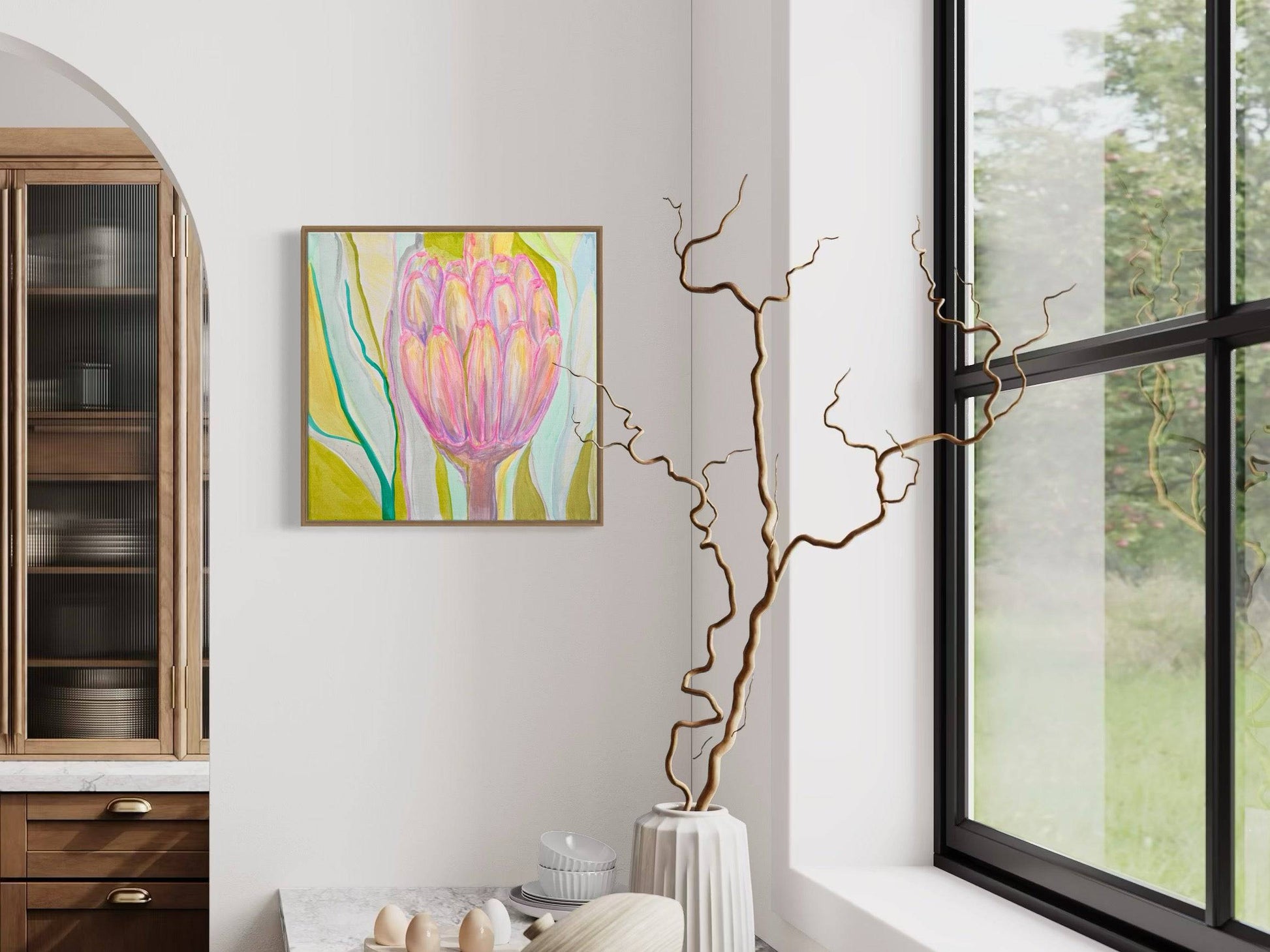 Interior with botanical pink protea painting by Kathryn Sillince on white wall, near window and modern kitchen