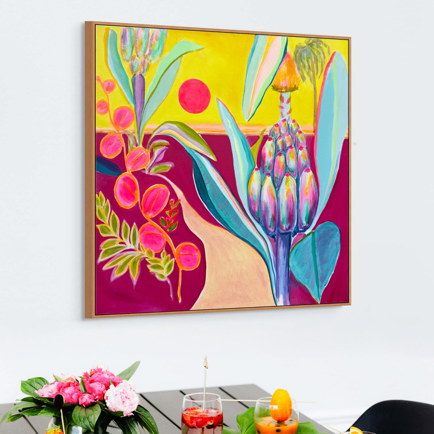 colourful contemporary landscape with banana plant and palm trees in a tropical setting with drinks

