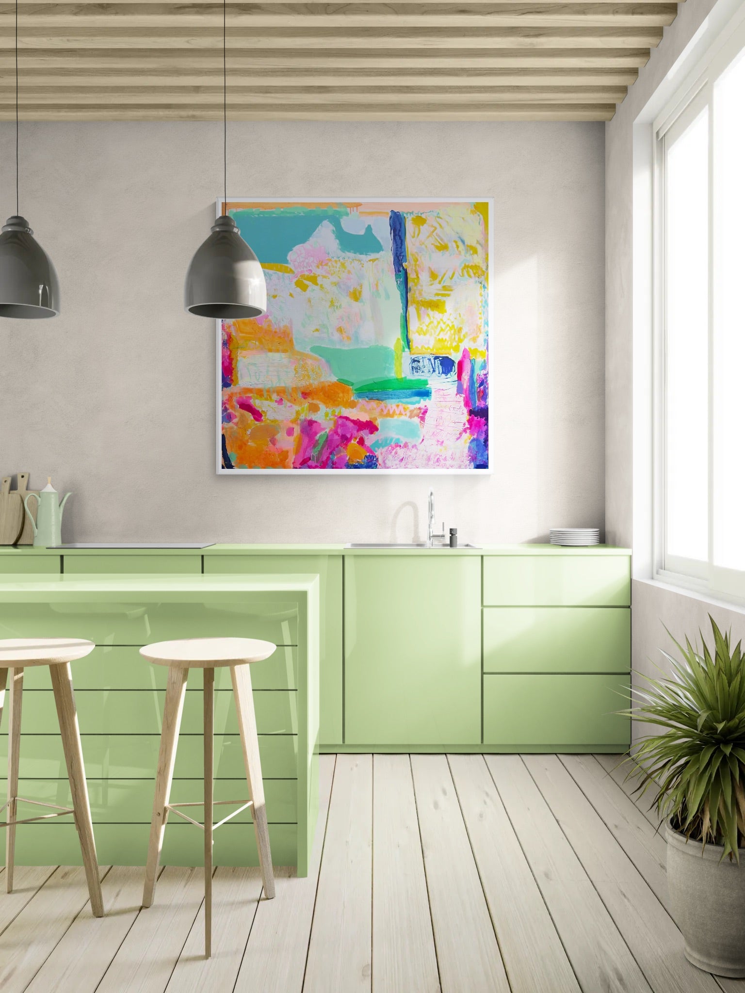 Modern kitchen with green cabinets, colorful abstract painting, and wooden stools.