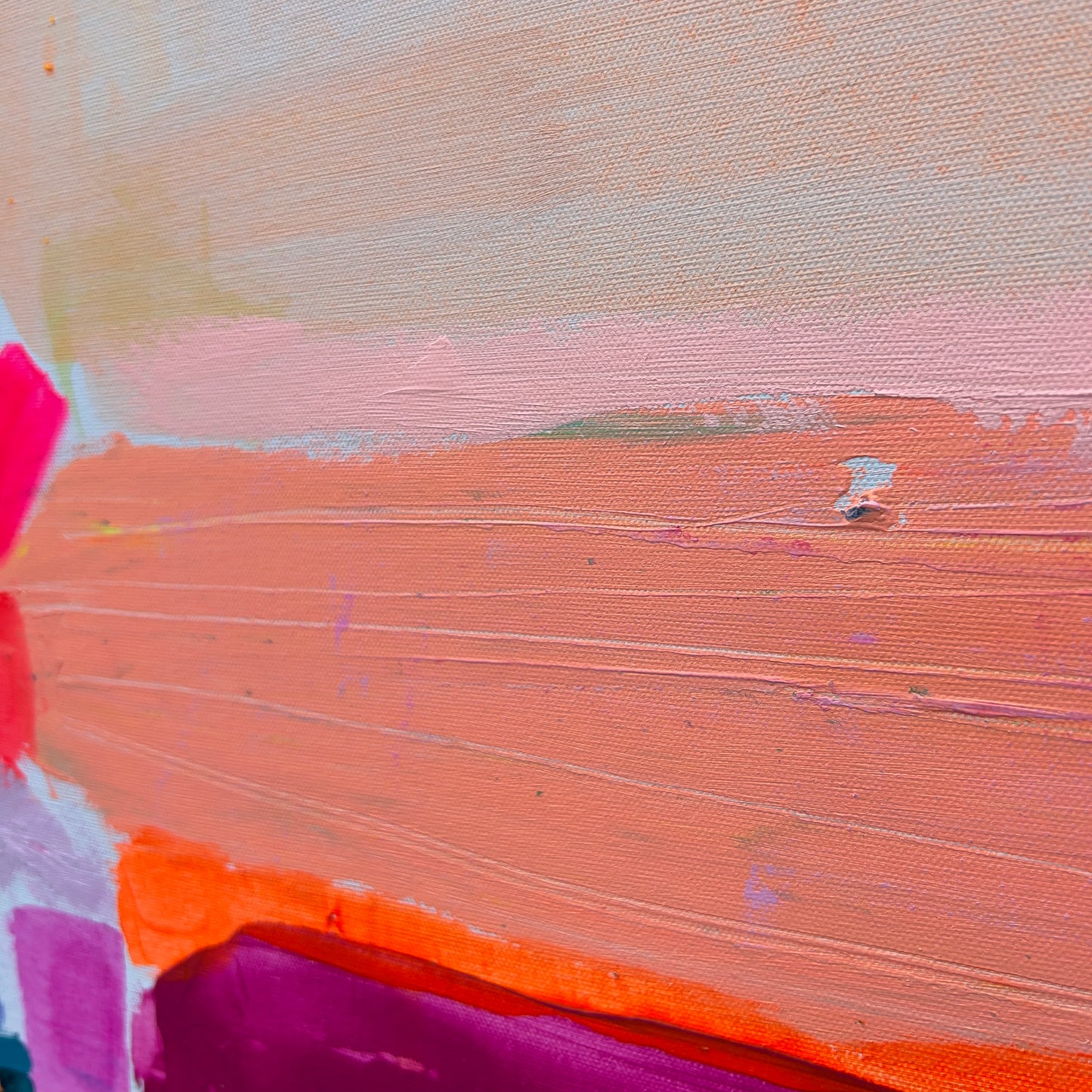 Close-up of a textured surface with colorful brush strokes