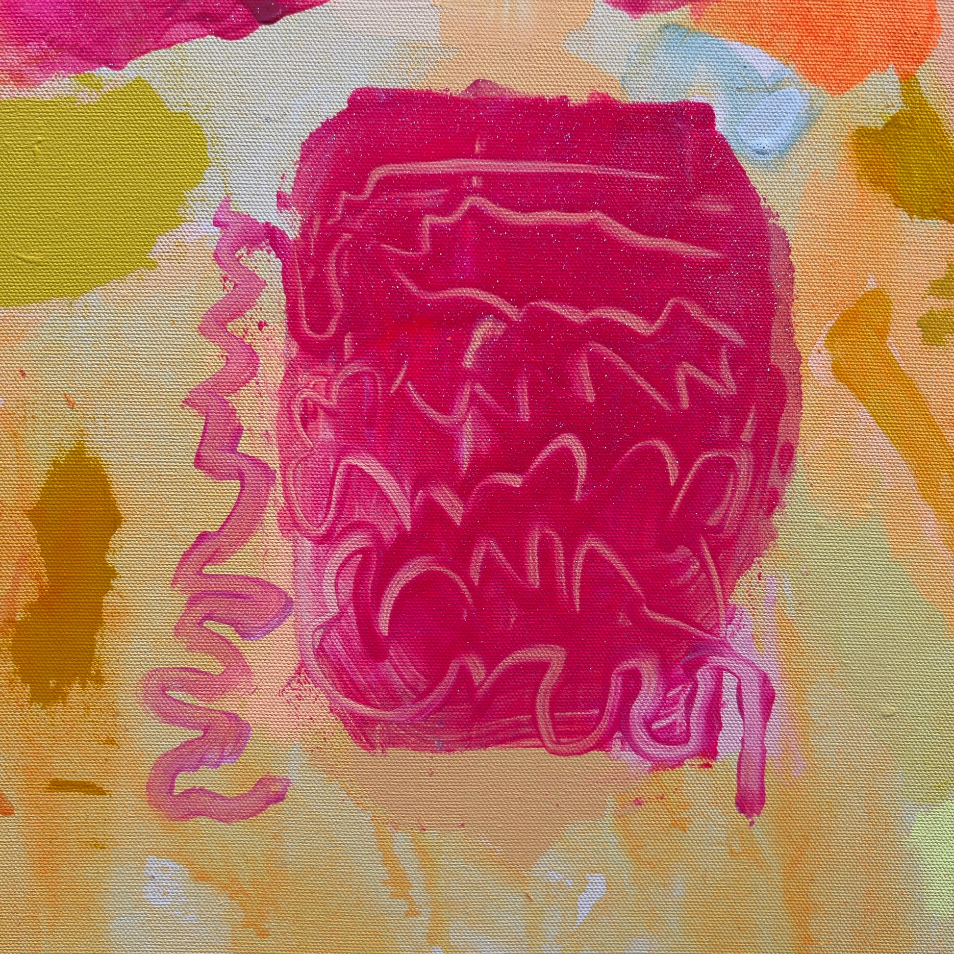 Abstract art with pink textured shape on a multicolored background
