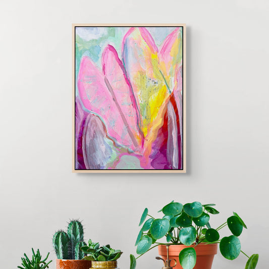 Colorful abstract painting on a wall above a wooden shelf with potted plants.